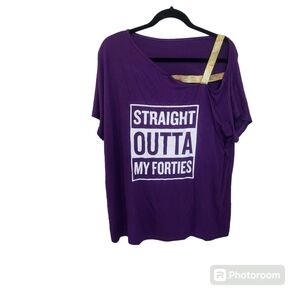 Graphic purple tee with gold shoulder straps. Straight out of my forties.